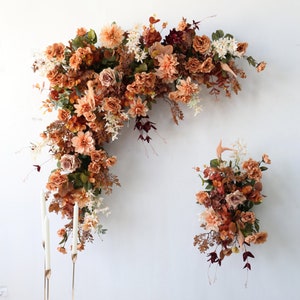 Autumn floral garland with peach, terracotta, and rust blooms for wedding arch backdrop