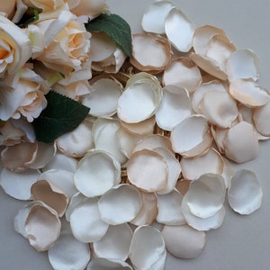 Ivory rose petals for tossing, scattered in a soft pile