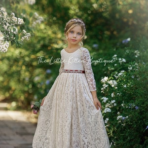 Ivory lace flower girl dress with long sleeves, fitted bodice, full A-line skirt