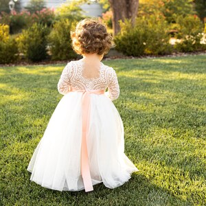 White lace top and white tulle back-party dress with scalloped shoulders, full skirt