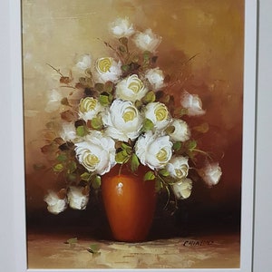 Floral oil painting with white roses in a brown vase on canvas, artist signature
