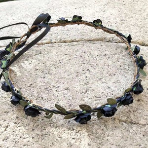 Dark flower crown headband with black blossoms and green leaves
