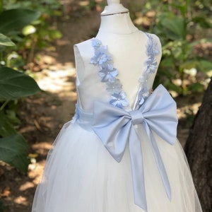 Dusty blue flower girl dress with V-back, lace details, tulle skirt, large bow