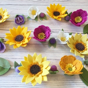DIY felt flower garland: assorted yellow and purple felt blossoms with dark centers