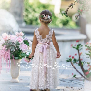 Ivory lace flower girl dress with open back and bow straps