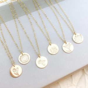 Gold-tone disc necklace with round stamped pendants on slim chain