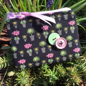 Small floral pot print fabric zipper pouch with mint button clasp