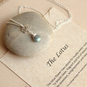 Sterling silver gemstone lotus necklace with tiny pendant and light blue stone