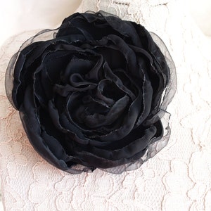 Black fabric rose flower brooch with layered petals, pin-back accessory