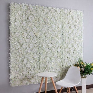 White 3D artificial flower wall panel, rectangular backdrop with dense blooms.