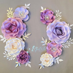Purple paper flower wall decor with layered roses and leaf accents