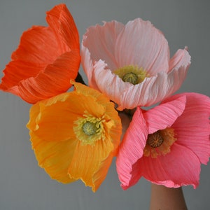 Paper poppy flower bouquet set with orange, yellow, pink, and pale pink paper blossoms