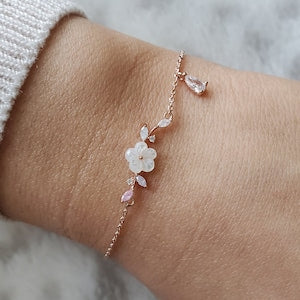Flower branch teardrop bracelet with floral and teardrop charms, rose-gold tone chain