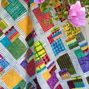 Colorful patchwork quilt design with geometric fabric blocks