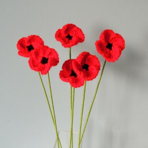 Crochet poppy flower bouquet with red blossoms on green stems