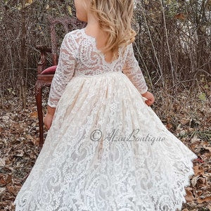 Ivory lace flower girl dress with long sleeves and scalloped neckline