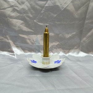 Porcelain flower candle holder with blue floral rim and gold candlestick