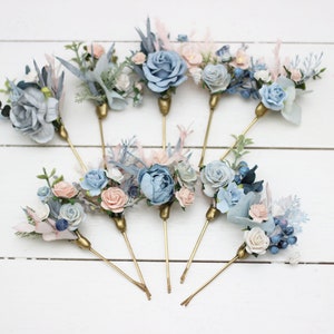 Floral bobby pins set with dusty blue, pink, and white flower accents