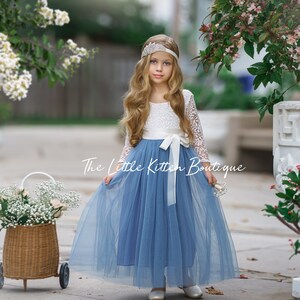 Dusty blue tulle flower girl dress with long lace sleeves and white waist bow