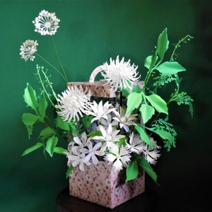 3D paper flower box with white blossoms and green leaves, open lattice sides