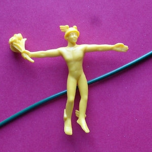 HERMES yellow bendable florist figure holding two flowers, arms outstretched