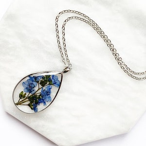 Pressed blue forget-me-not flower pendant necklace with silver-tone chain
