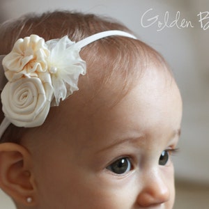 White flower girl headband with three fabric blossoms and soft ribbon tie