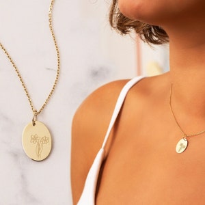 14K solid gold dainty birth-flower necklace with round engraved floral charm on chain