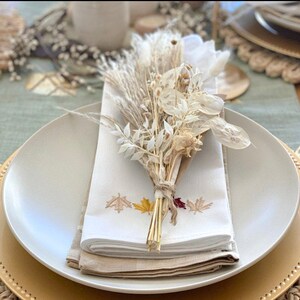 Mini dried flower bouquet with cream blooms, tied stems, for table styling