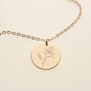 Gold iris engraved round pendant necklace on a fine chain