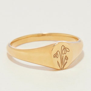 Gold-tone petite signet ring with engraved birth-flower outline on the top