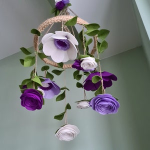 Felt flower nursery mobile with lavender and white flowers and green leaves