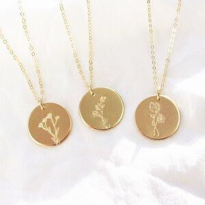 Gold-tone birth month flower charm necklace with round disc pendants and fine chain