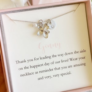 Silver flower girl necklace with butterfly flower pendant on a delicate chain