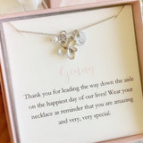 Silver flower girl necklace with butterfly flower pendant on a delicate chain
