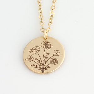 Gold birth flower bouquet necklace with round pendant engraved with flowers and leaves