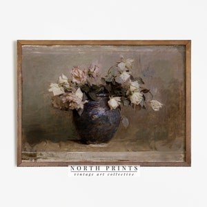 Vintage botanical still life print with pale flowers in a dark vase, framed