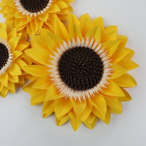 Yellow sunflower paper flower decorations with dark textured centers
