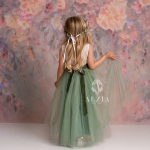 Sage green sleeveless lace bodice tulle dress with scalloped hem, back view