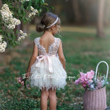 Ivory tulle flower girl dress with lace bodice and back bow, sleeveless