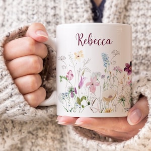 Personalized white coffee mug with wildflower bouquet and name Rebecca on front