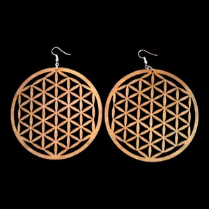 Round wood drop earrings with flower-of-life geometric pattern, light natural color