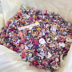 Biodegradable wedding confetti made of dried flower petals, multicolor toss pile.