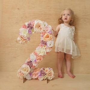 Floral flower number decoration shaped like a large numeral, with pastel roses and greenery