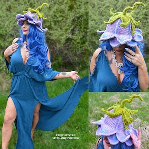 Blue and purple crochet fairy hat with layered flower accents and green/yellow trim