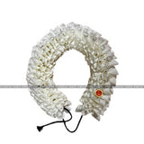 White satin folded round flower hair accessory with red center, tied string
