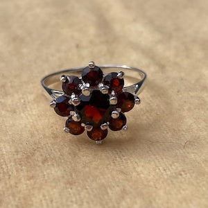 Silver garnet cluster ring with dark red gemstone cluster