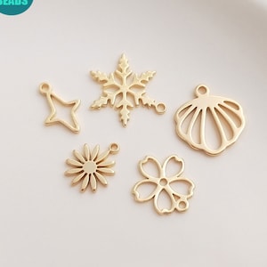 Set of tiny 14K gold-plated hollow flower and star charms, flat cutout shapes