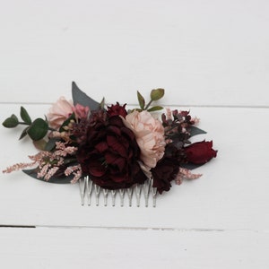 Floral hair comb headpiece with burgundy, blush, and dark red flowers and leaf accents