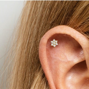 Tiny flower rhinestone cartilage stud earring on ear cartilage/tragus